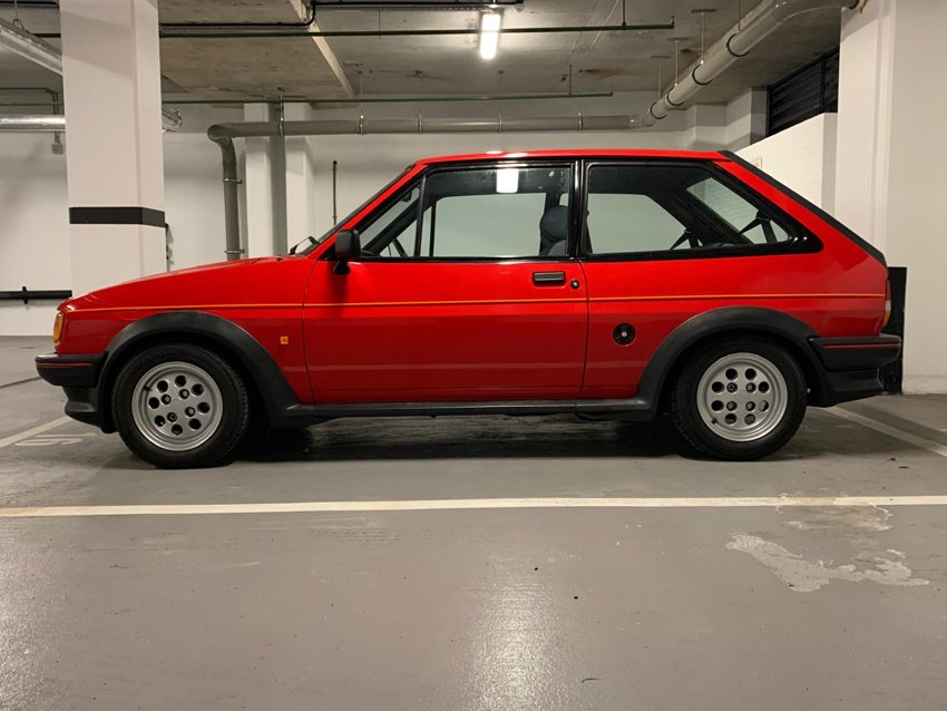 A clean side profile in an indoor parking area.